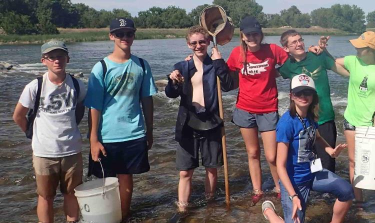 students posing with water sampling equipment