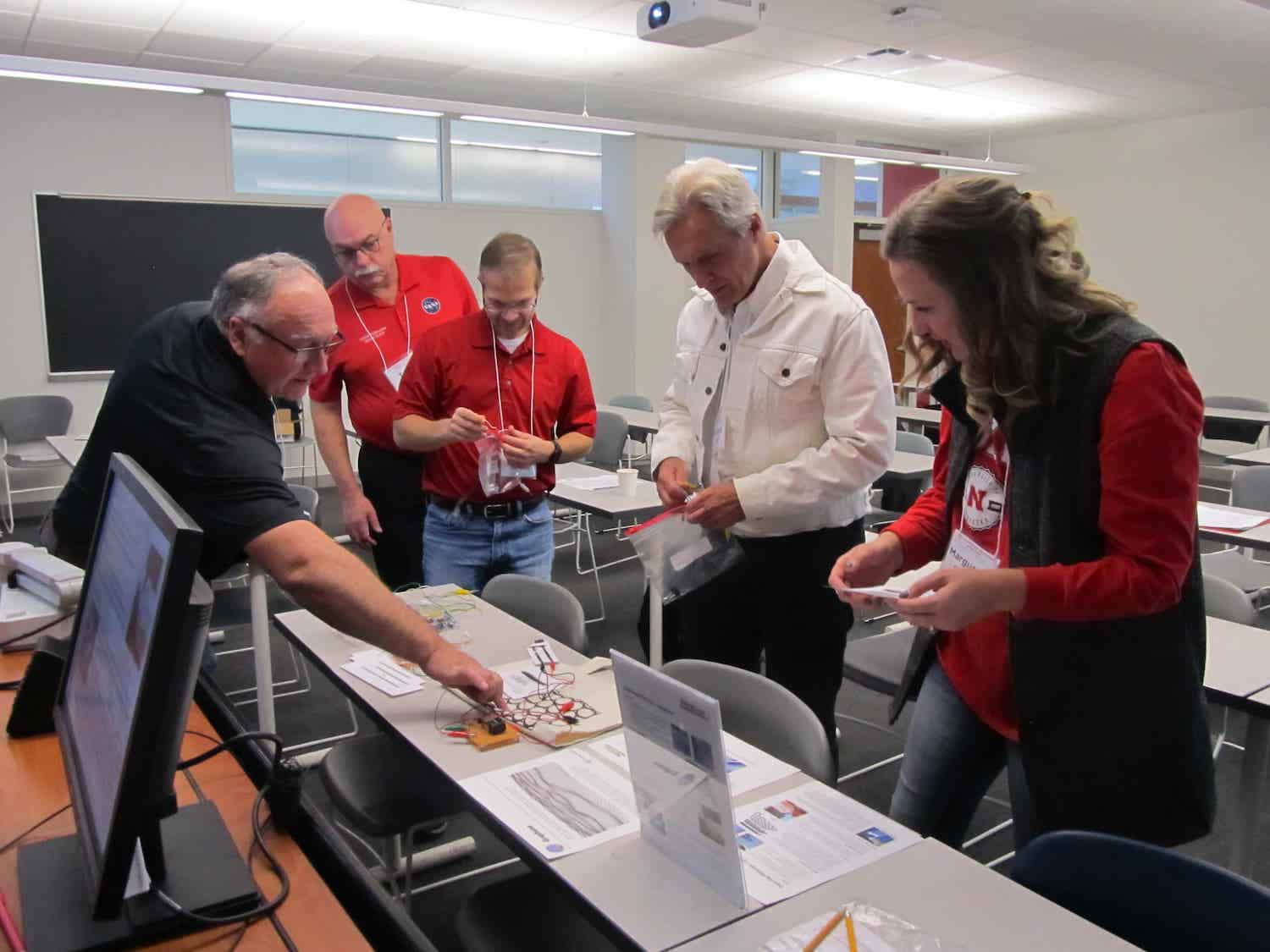 teachers playing a game designed to teach students about nanoscience